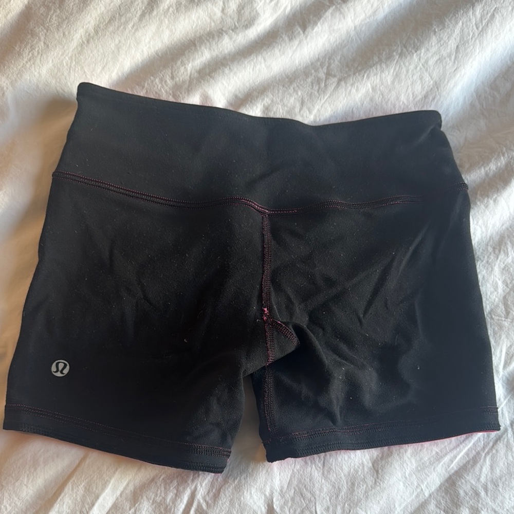 lululemon size 4 black reversible hot pink shorts